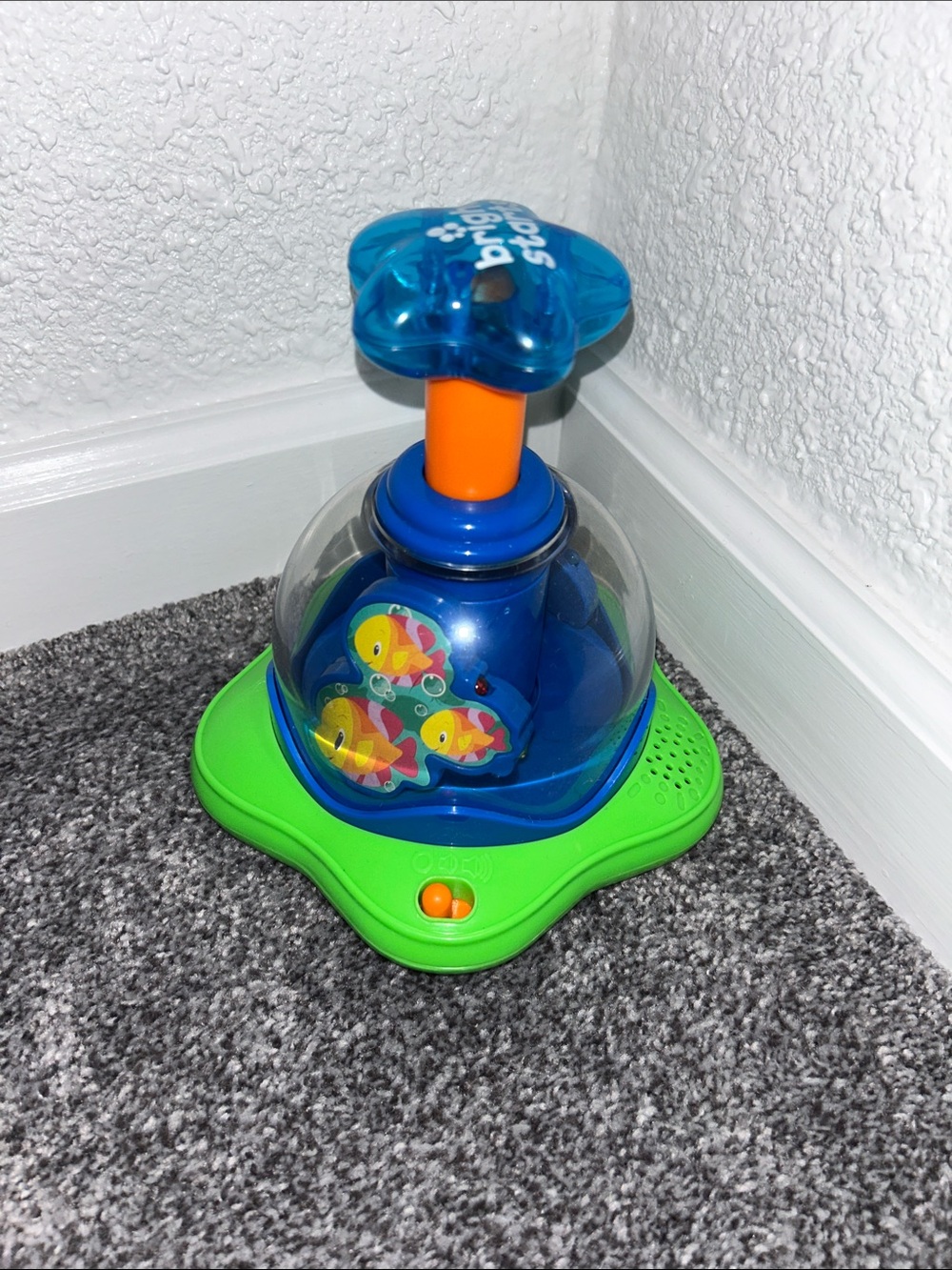 Bright Starts- Press & Glow Spinner Toy